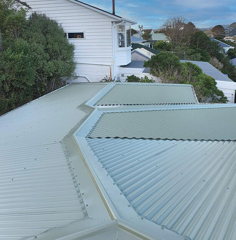 Old home reroofed with silver corrugated iron